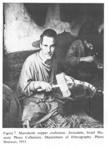 Encyclopaedia Judaica:
                      Jews in Morocco, vol.12, col.335: Marrakesh copper
                      craftsman. Photo: Shulman, 1953