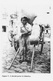 Encyclopaedia Judaica (1971): Lithuania,
                          vol. 11, col. 379-380, photo 1: a Jewish
                          porter in Jubarkas with hand car