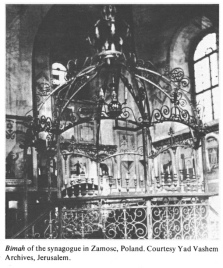 Encyclopaedia Judaica (1971): Zamosc, vol. 16,
                  col. 927. Bimah [[platform with Torah stands]] of the
                  synagogue in Zamosc, Poland. Courtesy Yad Vashem
                  Archives, Jerusalem.