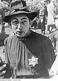Holland, Jewish woman with a bright Jewish
                        star with the inscription "Jood"
                        ("Jew"), 1942