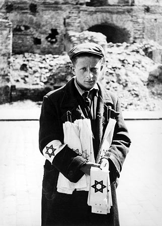 Armband distributor
                        with armbands with Jewish star on white
                        background