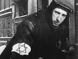 Poland,
          man with armband with Jewish star, Warsaw ghetto 1943