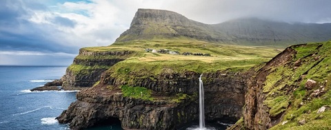 Faroe Islands: Mountains and
                    waterfall at the cliff coast