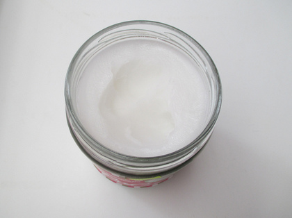 coconut oil in open glass, solid state coconut oil in open glass, solid state